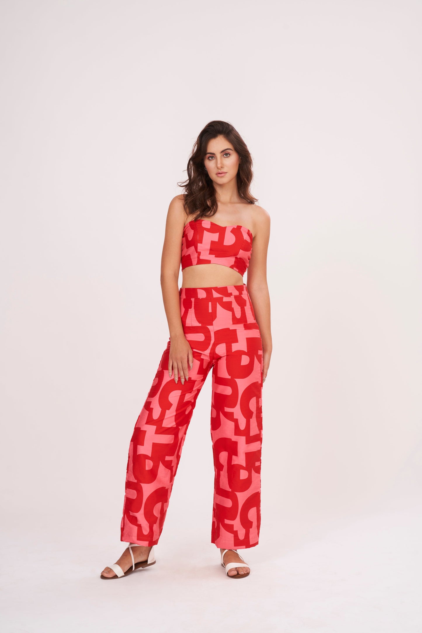 Red Co Ord tube crop top in lightweight cotton satin, featuring pink-red geometric print. Snug yet comfortable fit flatters the figure, perfect for summer days.