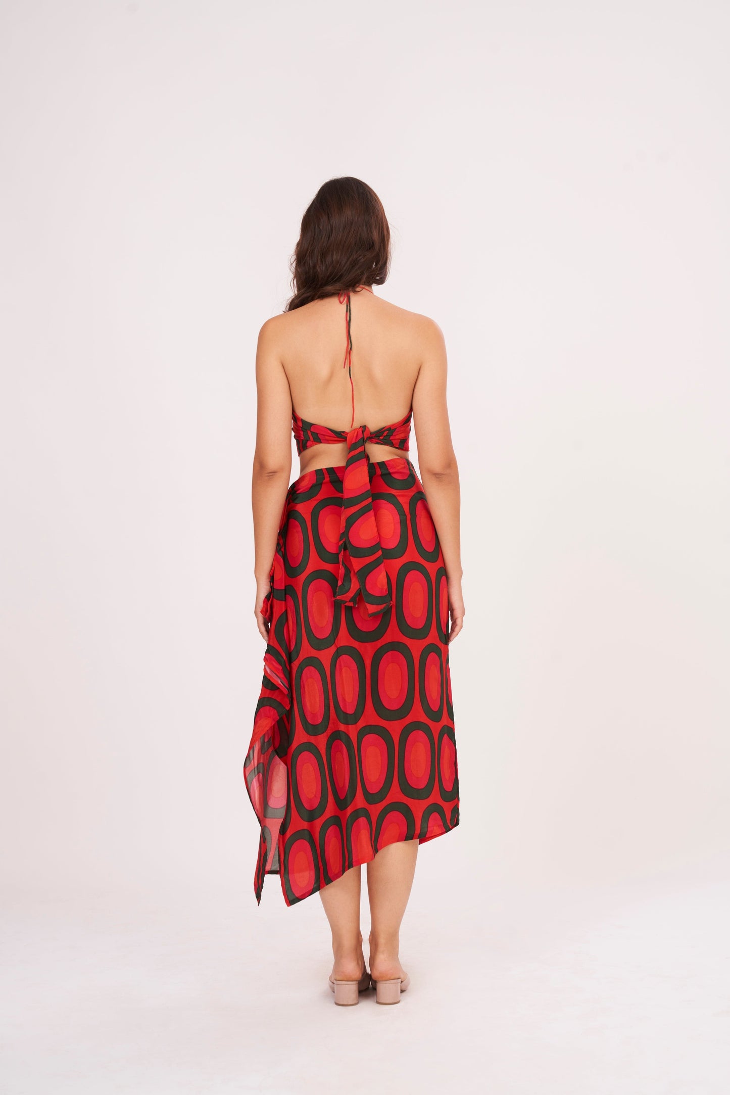 A stunning long skirt with a slit and cascading ruffles, offering a flirty and fun look while accentuating the silhouette, made from high-quality crepe.