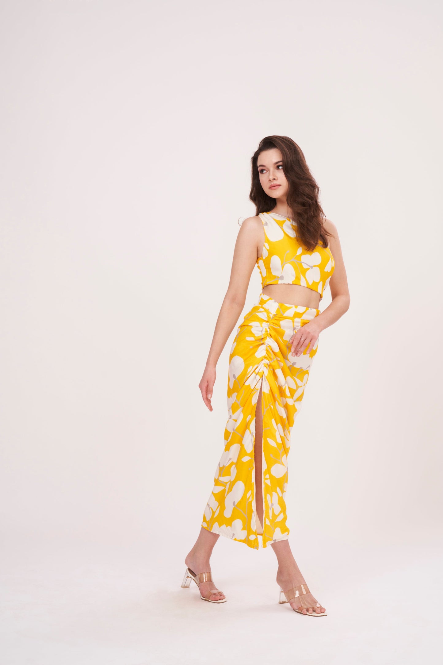 Elegant one-shoulder yellow top designed to flatter waist and accentuate curves. Lightweight fabric ensures comfort and coolness, perfect for summer outings.