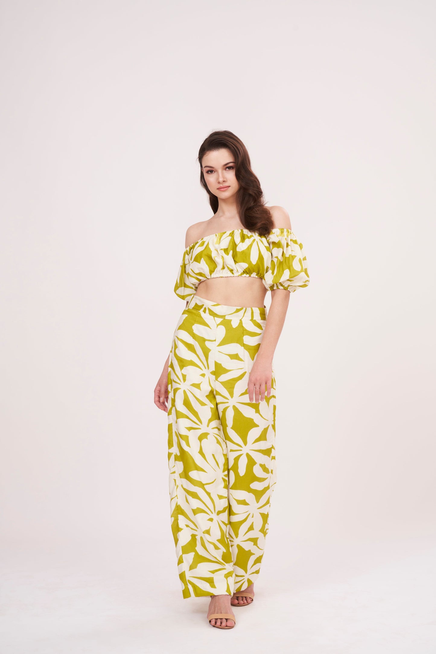 Green geometric print, loose-fit, wide-legged flowy trousers perfect for a breezy, relaxed feel during summer.