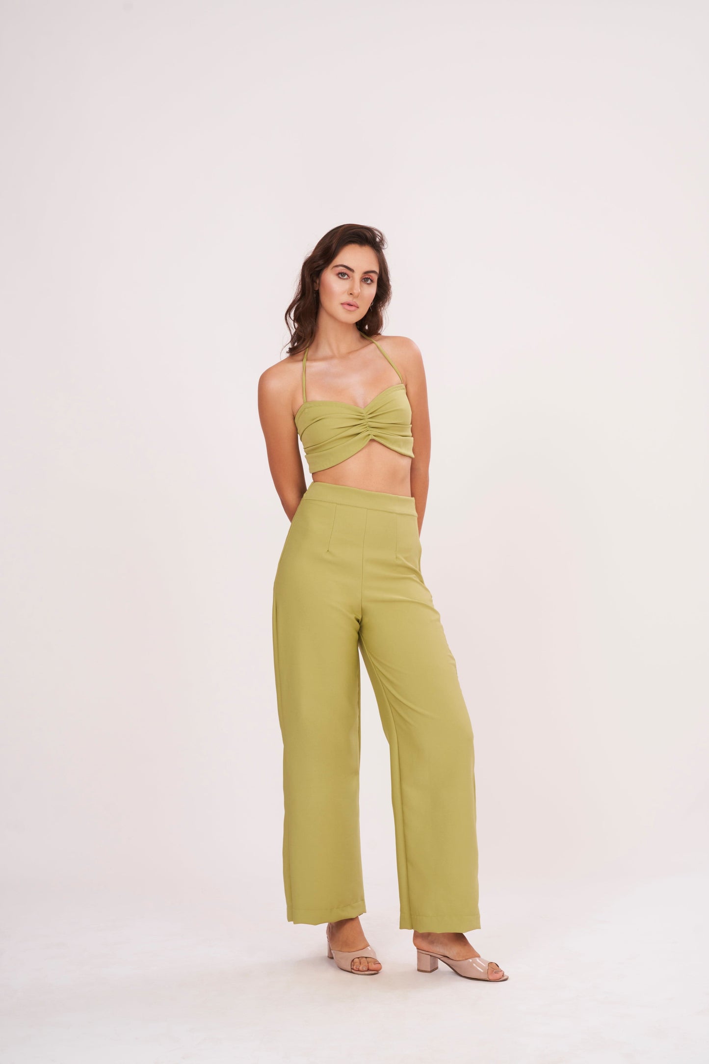 Elegant green halter neck bralette with ruched detailing and tie-up closure, part of a chic co-ord set for confidence and style.
