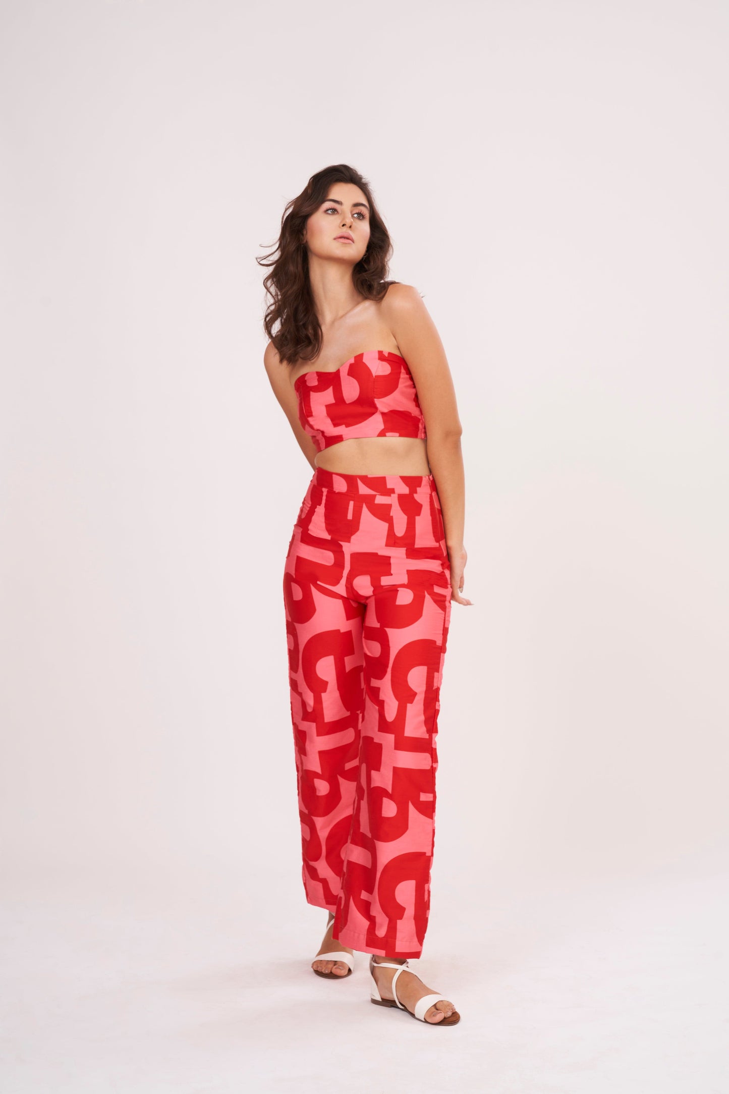 Red Co Ord tube crop top in lightweight cotton satin, featuring pink-red geometric print. Snug yet comfortable fit flatters the figure, perfect for summer days.