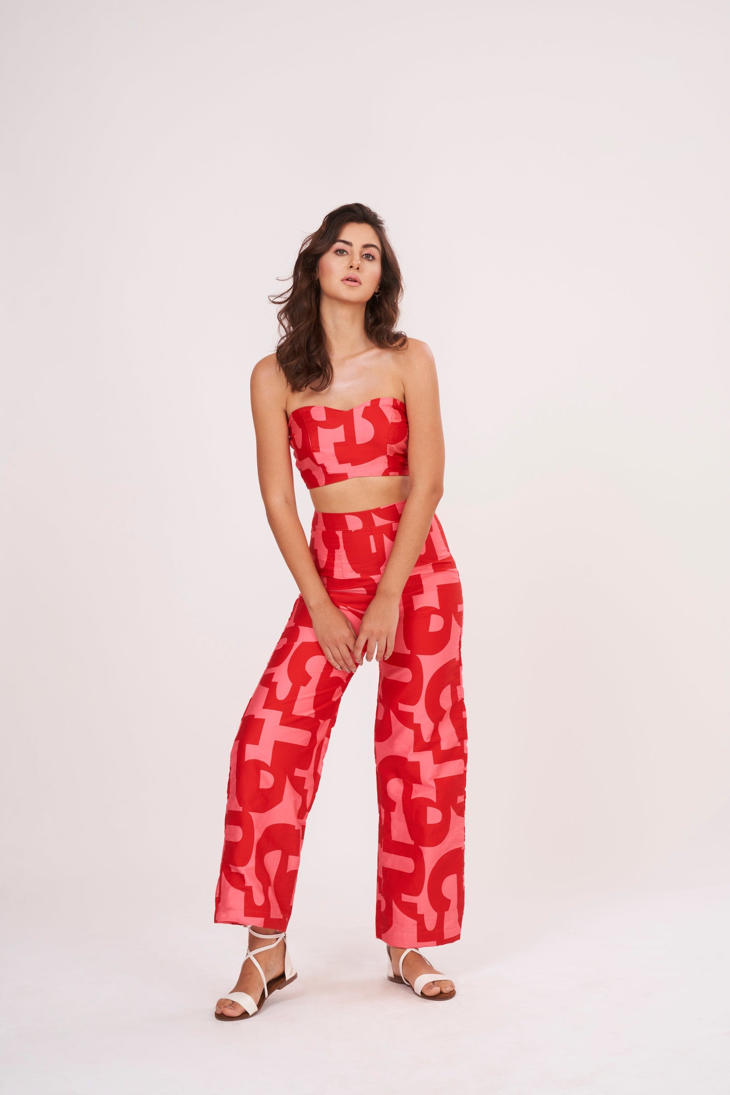 Red Co Ord tube crop top in lightweight cotton satin, featuring pink-red geometric print. Snug yet comfortable fit flatters the figure, perfect for summer days.
