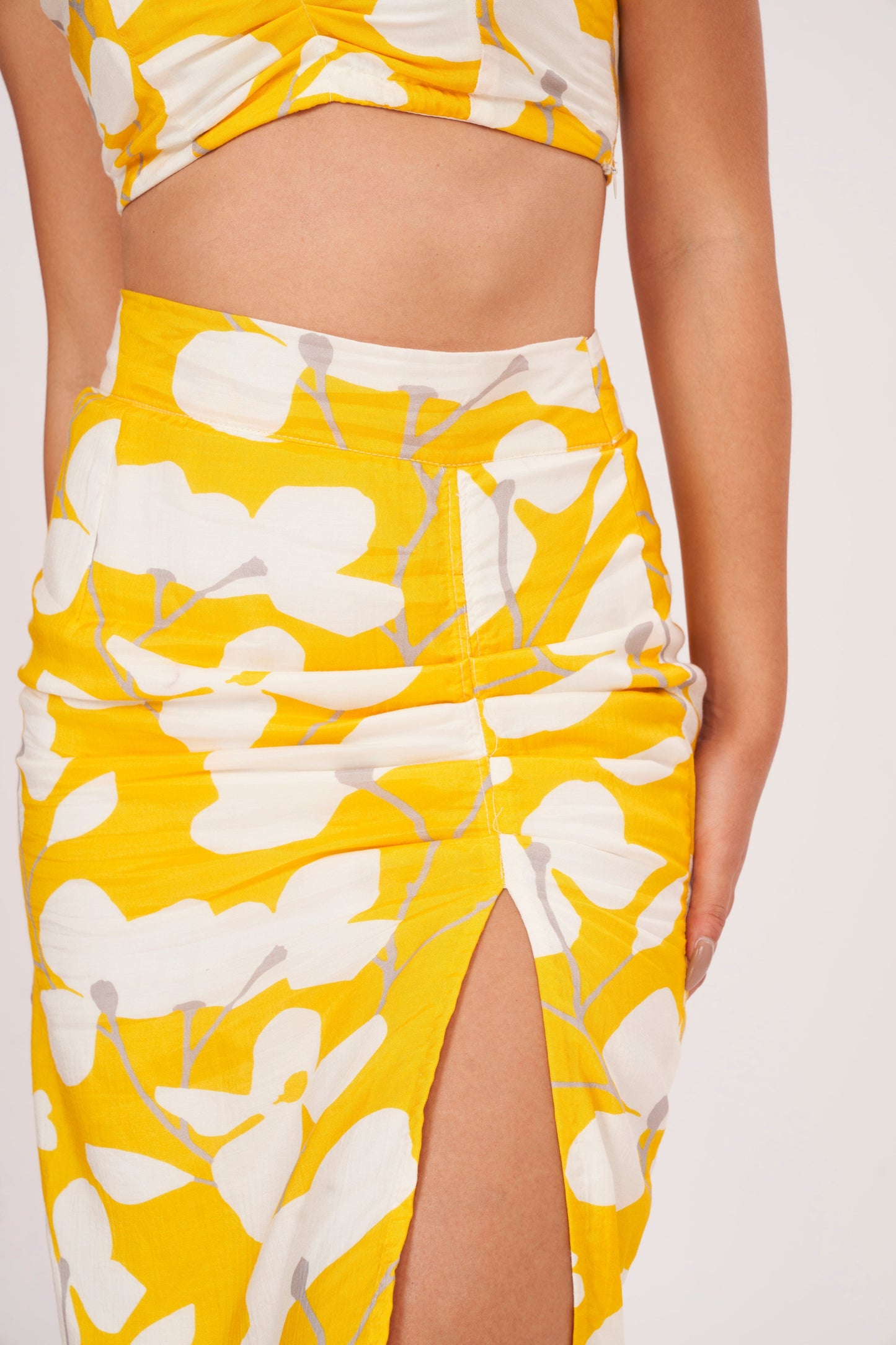 Thigh-length floral skirt with lightweight muslin fabric, ensuring comfort in hot weather. Abstract print exudes sophistication, while trendy cut complements modern appeal.