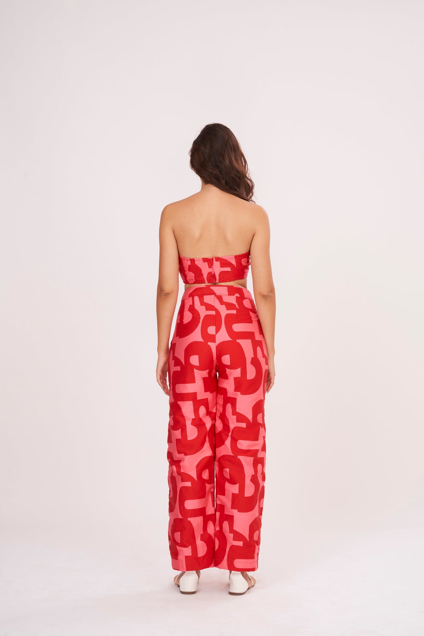 Red Co Ord tube crop top in lightweight cotton satin, featuring pink-red geometric print. Snug yet comfortable fit flatters the figure, perfect for summer days.