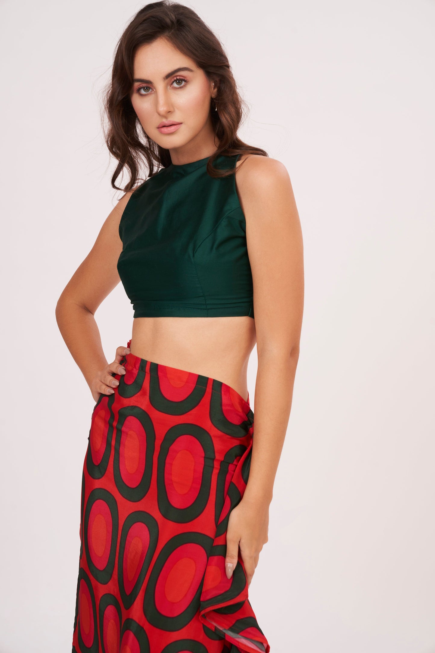 Fitted crop top with abstract design, made of durable crepe fabric, perfect for showcasing your style at any occasion.