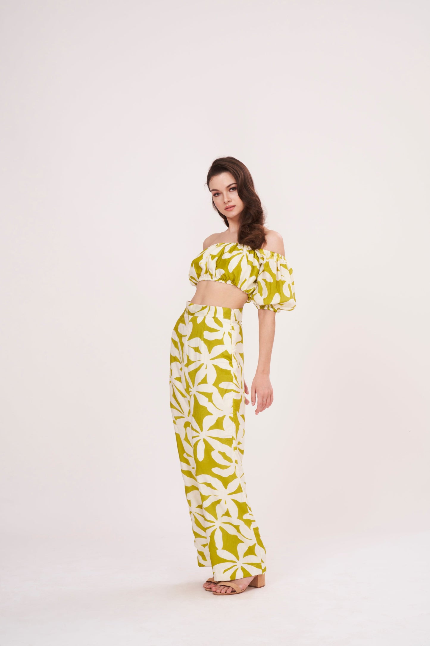 Green geometric print, loose-fit, wide-legged flowy trousers perfect for a breezy, relaxed feel during summer.