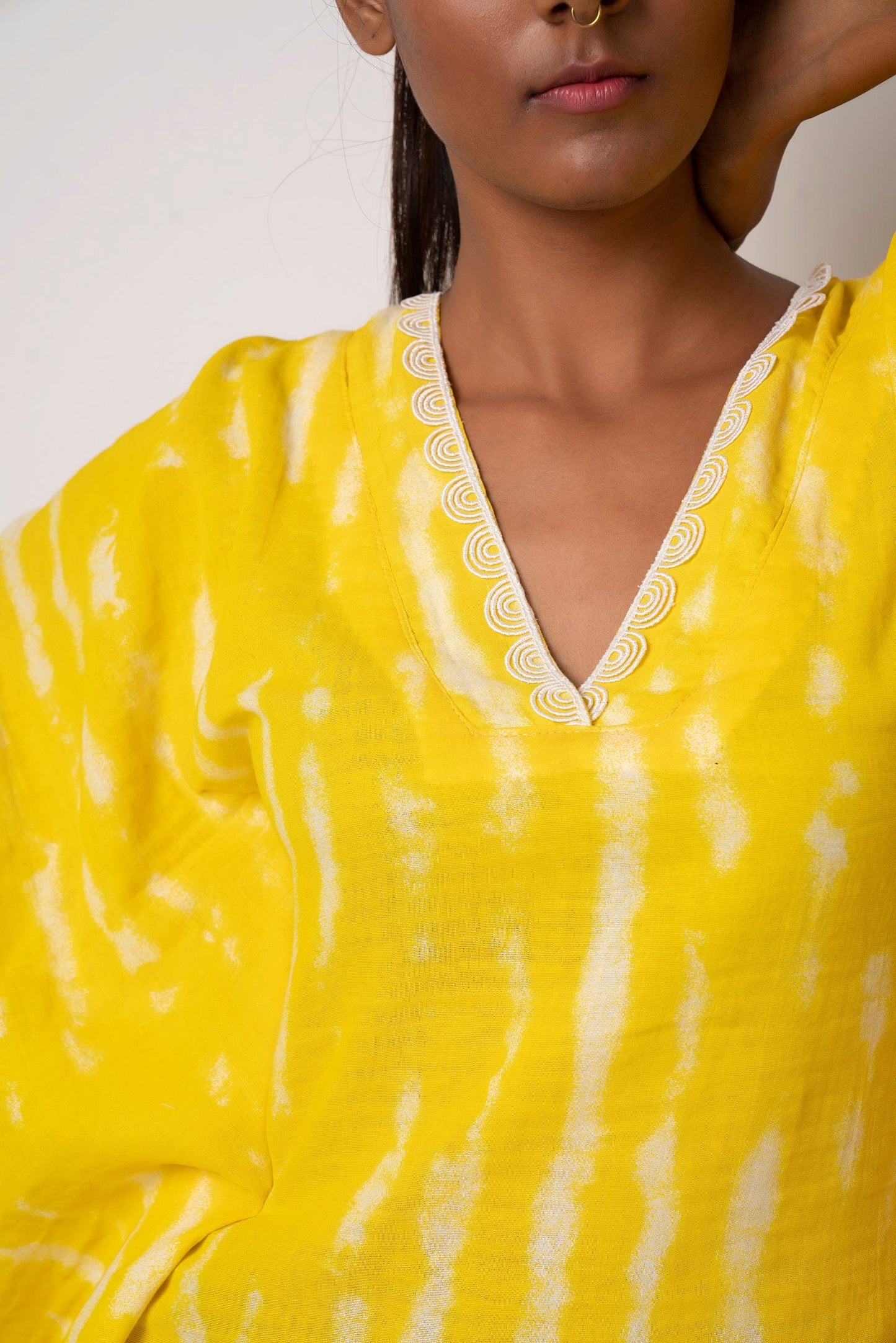 Add a pop of color to your outfit with this vibrant yellow tie-dye short beach dress. It comes with kimono-style sleeves, yoke collar, and lace detailing and is perfect as a beach vacation dress or for a casual day out.