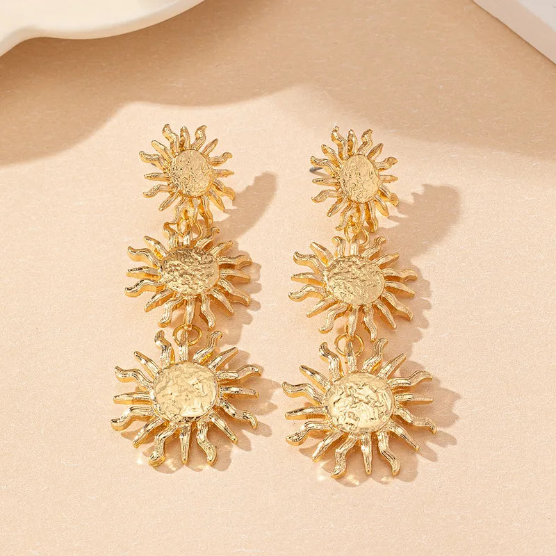A beautiful example of celestial-inspired jewelry, these polished gold-toned earrings offer a bold yet classic aesthetic that effortlessly elevates a simple black dress or your favorite resort wear.