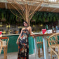 Lightweight chiffon blend halter maxi dress with fluid drape and colorful abstract design