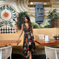 Relaxed fit boho maxi dress with adjustable halter tie and bold abstract pattern