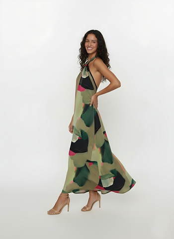 Abstract Grace Maxi Dress featuring a sophisticated criss-cross halter neckline and a fluid, floor-grazing silhouette.