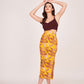 Model standing with both hands on top of her head, showcasing the full front view and fitted silhouette of the dress.