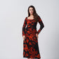 Angled front pose showing the silhouette and sleeve fit of the ankle-length dress.