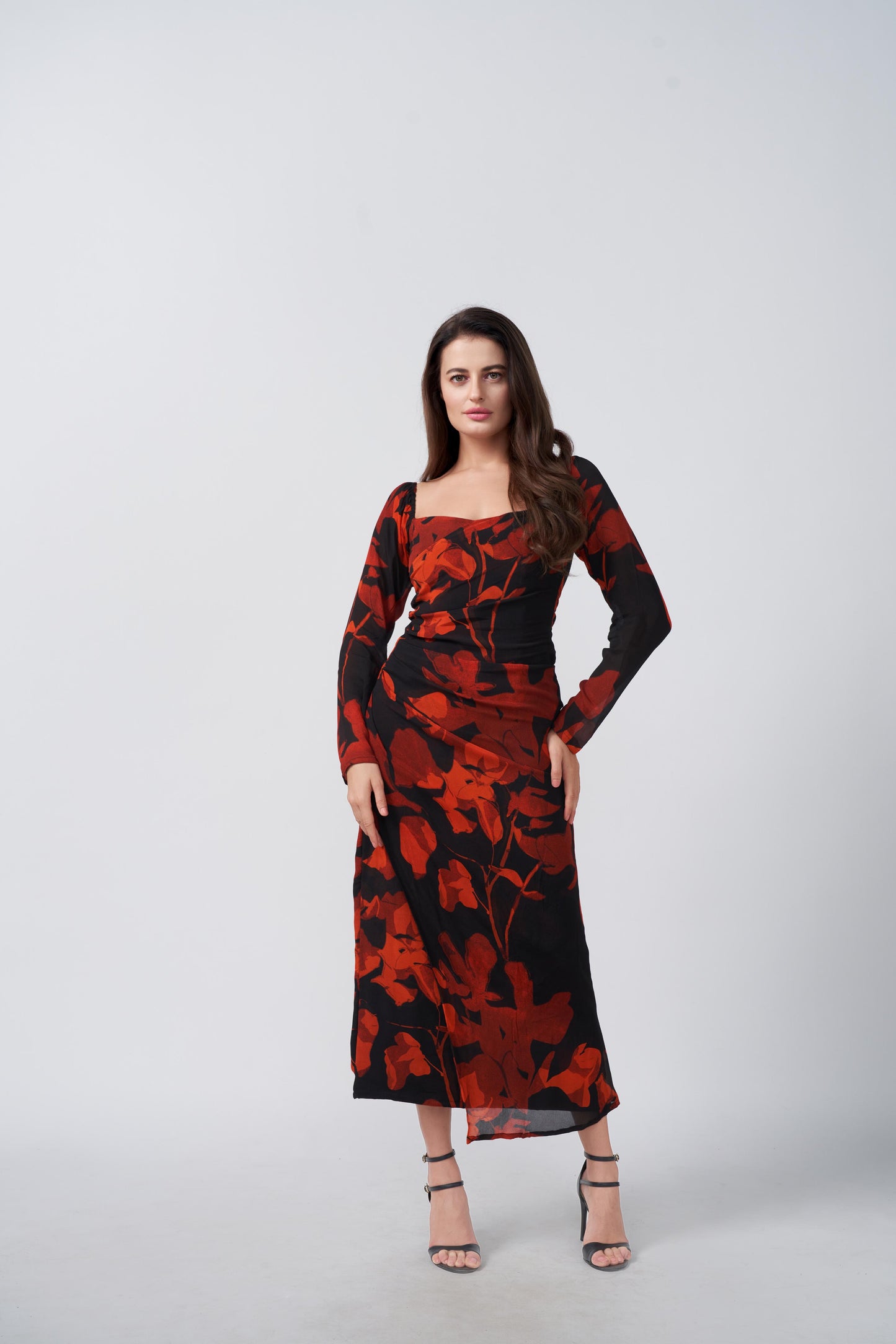 Angled front pose showing the silhouette and sleeve fit of the ankle-length dress.