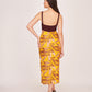 Rear view of the dress featuring back zip closure, maroon solid bodice, and multicolour abstract printed skirt.