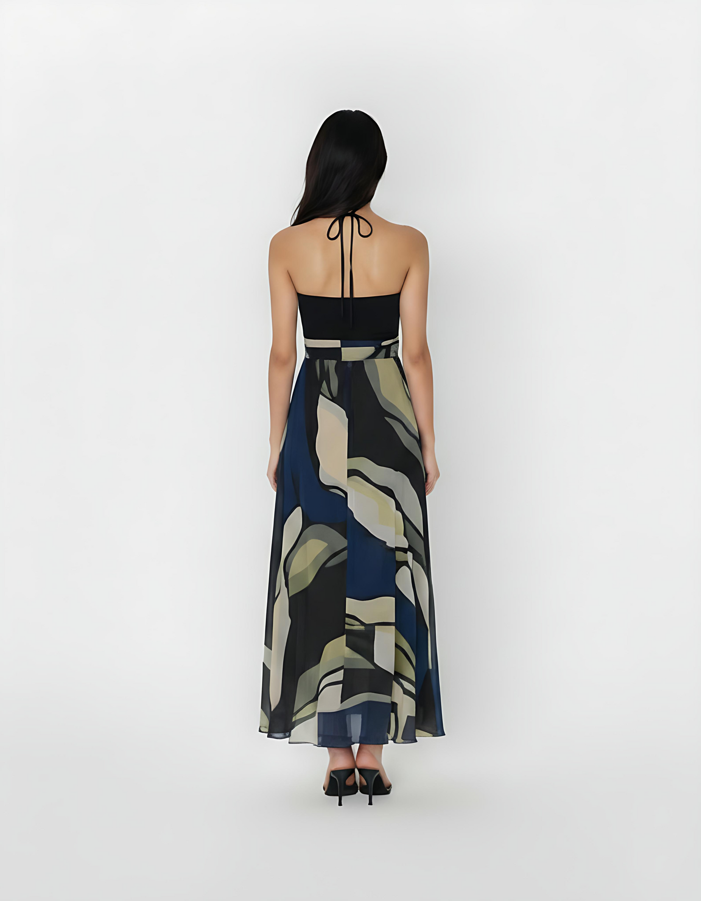 Ankle-length crepe halter dress with a tie-back neckline, featuring a flowing silhouette and a navy blue and olive abstract floral print for a refined, contemporary look.