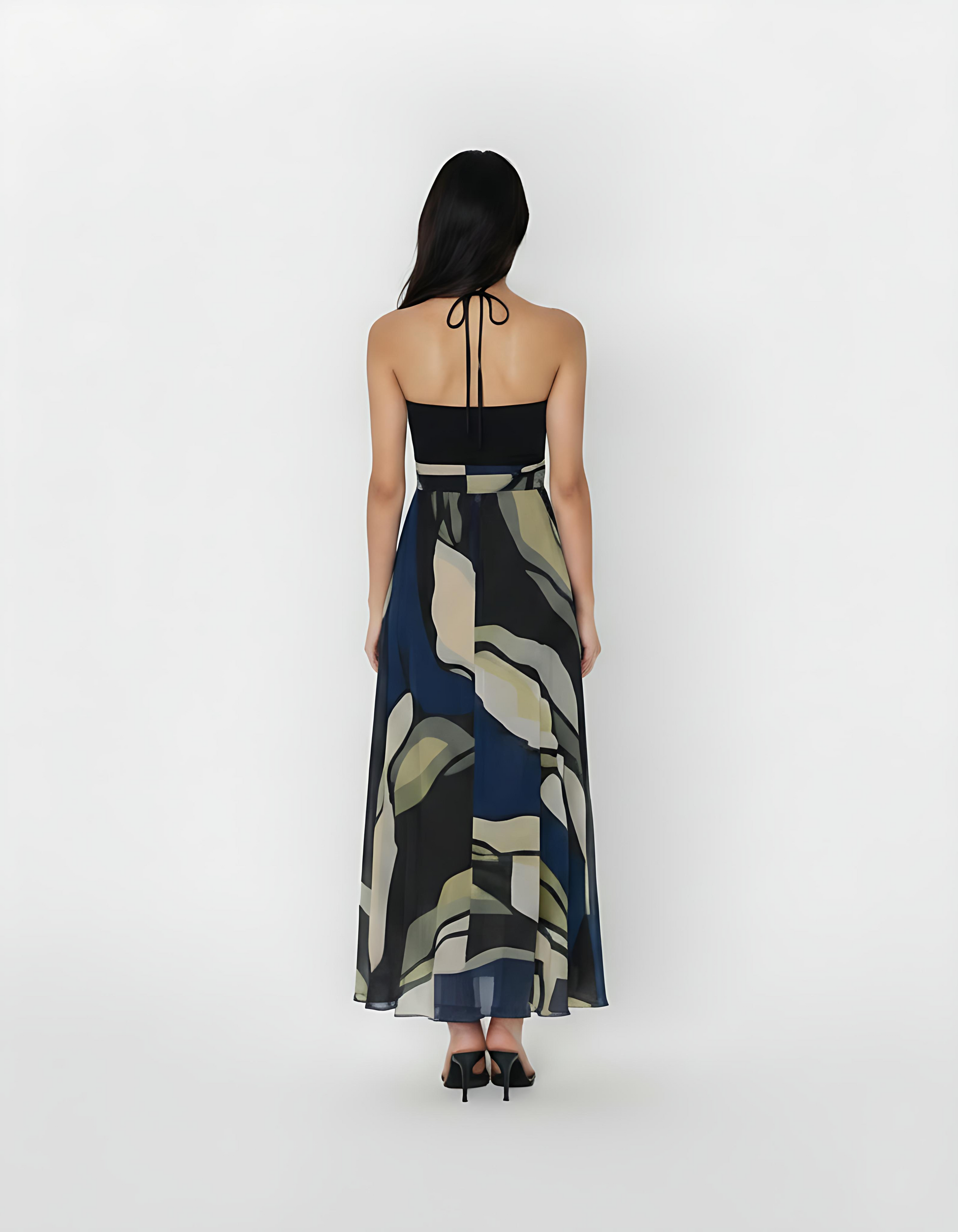 Ankle-length crepe halter dress with a tie-back neckline, featuring a flowing silhouette and a navy blue and olive abstract floral print for a refined, contemporary look.