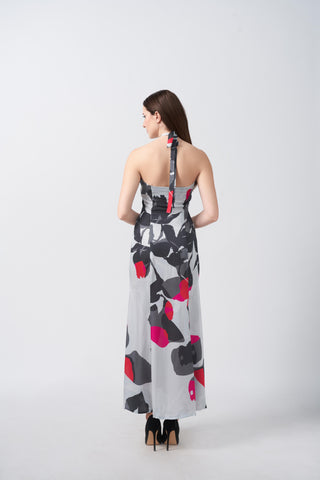 Back view of an ankle-length satin dress with a halter tie-back neckline