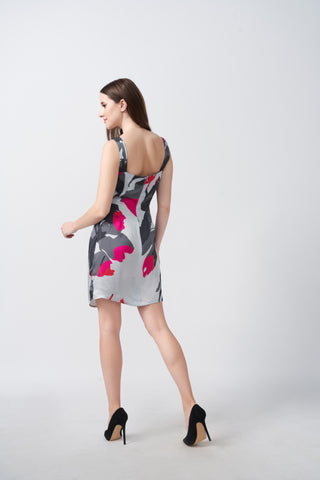 Square back design with wide shoulder straps and a concealed zipper closure, maintaining a sleek and fitted silhouette.