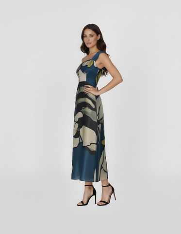 Ankle-length gown with a tailored side fit that highlights the smooth, flowing drape of the fabric in crepe. The large-scale botanical pattern continues seamlessly around the body, offering a sophisticated look for garden parties or elevated resort wear.