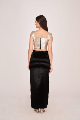 Rear view showcasing a sleek, exposed zipper on the silver top and the clean, column-like cut of the skirt for a polished look from every angle.