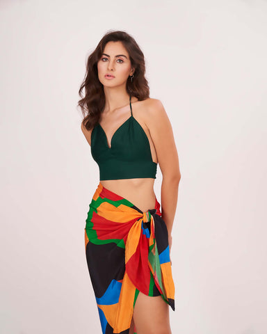 Deep green halter-neck crop top featuring a plunging neckline and backless tie-up design for a sleek, adjustable fit.