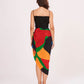 Rear view of the beach co-ord set showing the back zip closure of the black dress and flowy multicolor sarong drape.