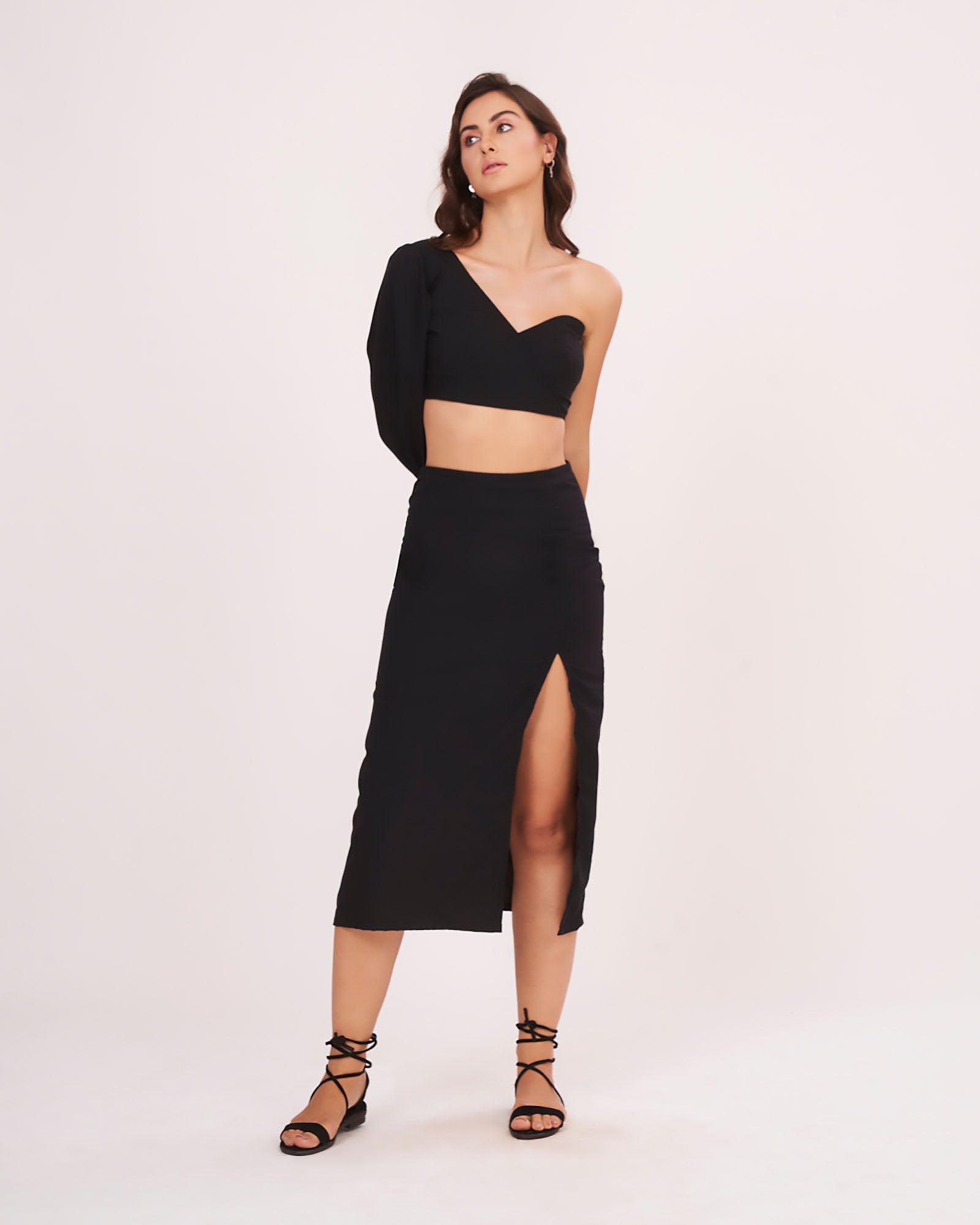Full frontal pose showing the sweetheart neckline and dramatic balloon sleeve paired with a high-waist solid skirt.