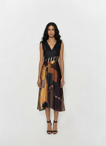 Sleeveless midi dress featuring a deep V-neckline and a solid black bodice that transitions into a multi-colored geometric mosaic print skirt.