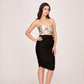 Model in a black and silver satin ruched dress with sweetheart neckline and strap shoulders, posing confidently.