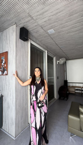 Halter-neck maxi dress crafted from a smooth, flowy crepe fabric featuring a relaxed yet tailored fit and a striking high-contrast color palette of noir and soft lilac.