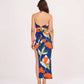 Rear view of the blue co-ord set with open back halter neck and skirt showcasing the back tie-up closure and vibrant floral pattern.