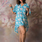 Blue floral georgette dress with shell-detailed slit sleeves, worn in kimono style with relaxed fit.