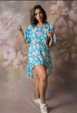 Blue floral georgette dress with shell-detailed slit sleeves, worn in kimono style with relaxed fit.