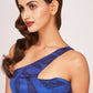 Close-up of the model in a digitally printed blue silk dress, highlighting the one-strap shoulder neckline and pattern.