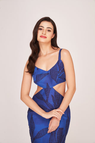 Sleeveless silk midi dress with a fluid drape and modern cut-out design