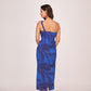 Back view of a blue silk one-shoulder dress with a back zip closure and clean silhouette