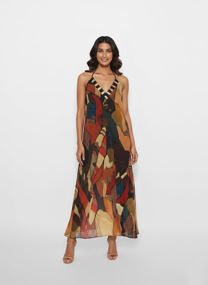 Full-length maxi dress featuring a deep V-neckline with a contrasting geometric-patterned border and halter neckline.