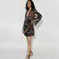 Mini dress with a deep V-neckline, long billowing sleeves, and a multicolored abstract print in earthy and vibrant tones