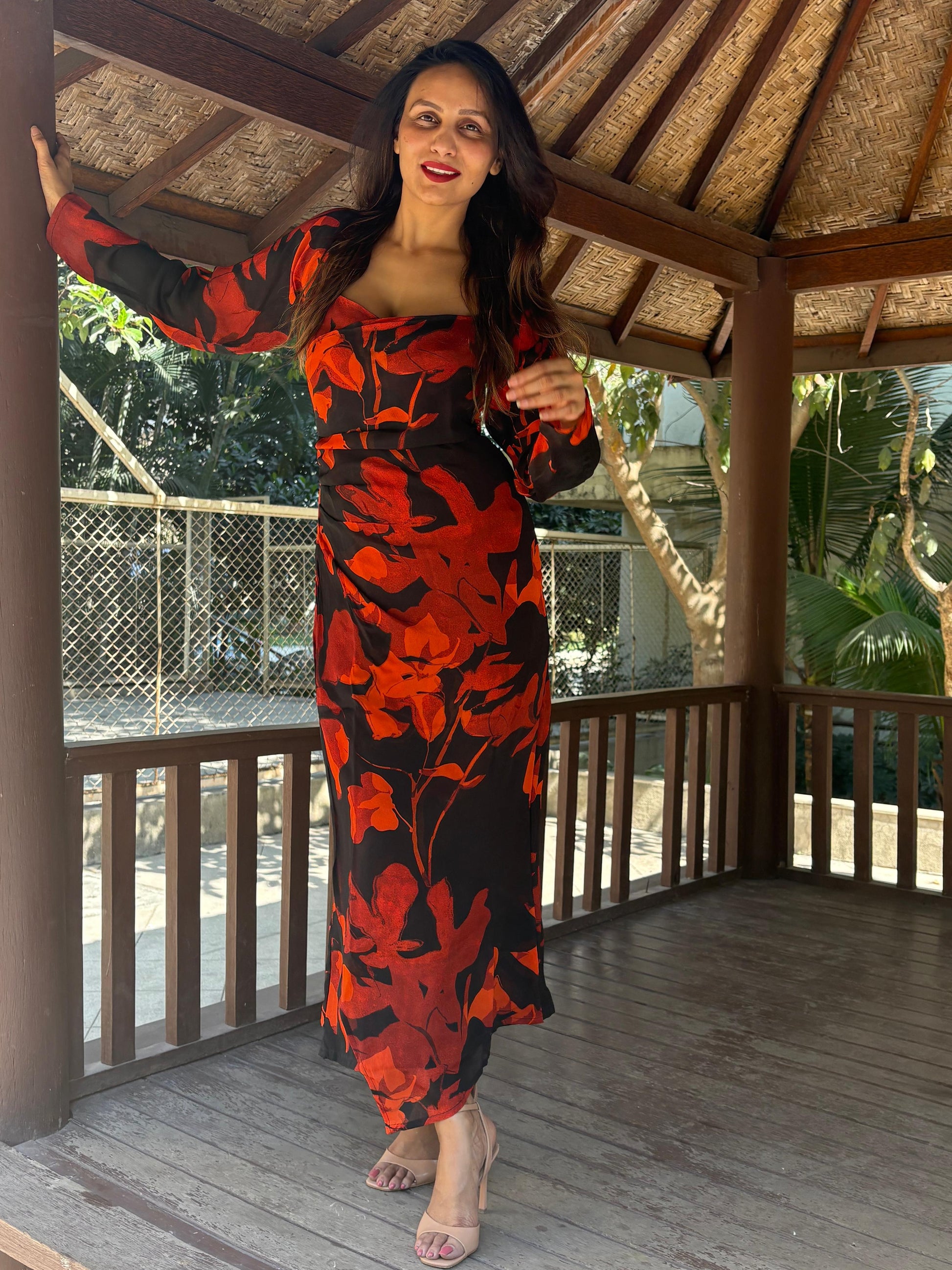 Ankle-length dress featuring a wide, structured square neckline and long sheer sleeves that create a refined and modest silhouette.