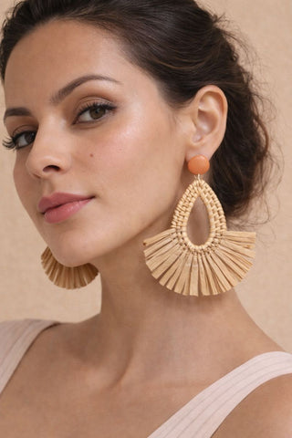 Brown geometric rattan earrings with a lightweight woven design.