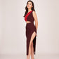 Model posing at an angle in a brown and red cut-out midi dress, showcasing the waist cut and side slit.