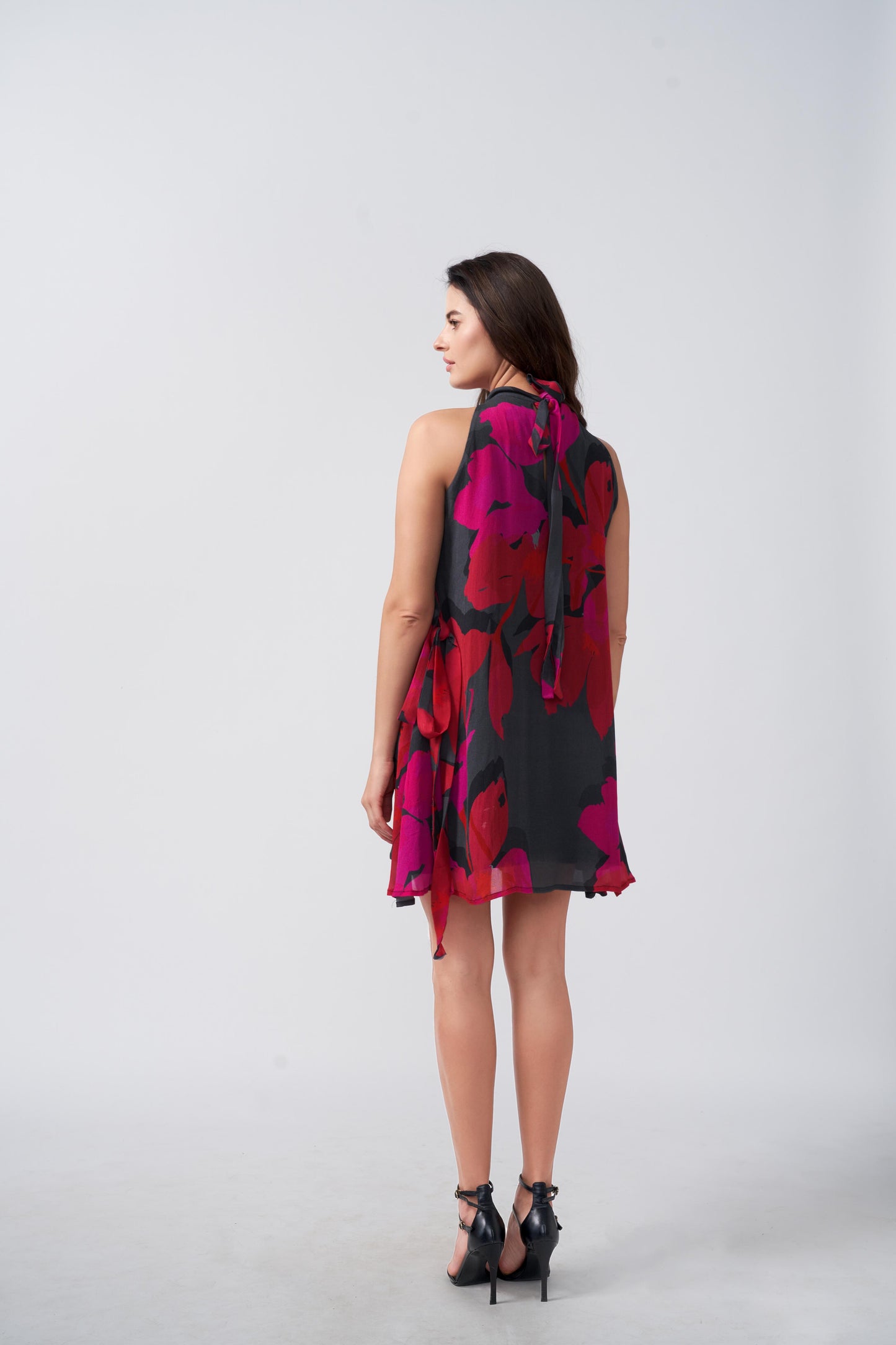Knee-length chinon dress with a halter tie-back neckline and flowing silhouette