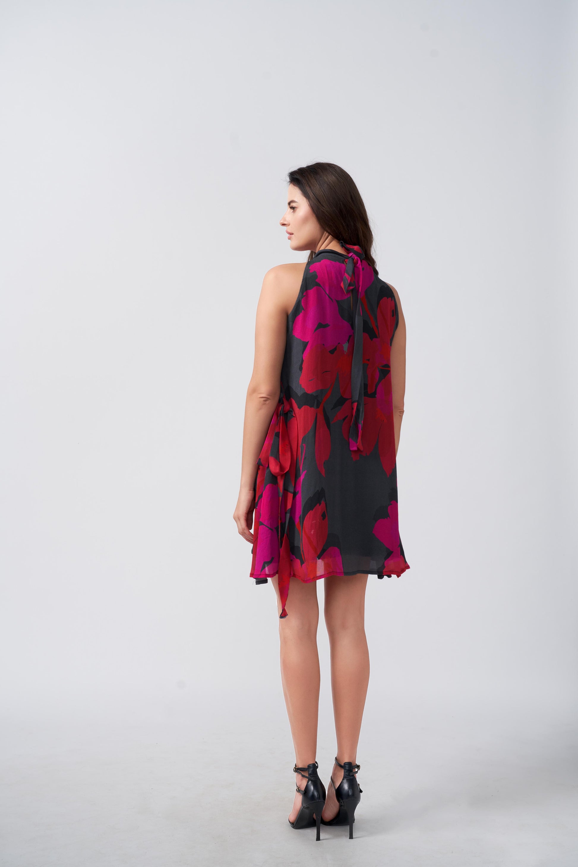 Knee-length chinon dress with a halter tie-back neckline and flowing silhouette