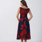 Back view of a sleeveless chinon midi dress with side waist cut-outs and a clean silhouette