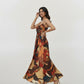 Strappy shoulder maxi dress with a bow detail and a flowing silhouette in a multicolored abstract print