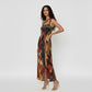 Sophisticated resort-style dress suitable for evening events or summer parties, showcasing a vibrant, artistic design.