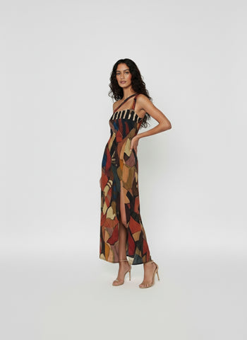 Sophisticated resort-style dress suitable for evening events or summer parties, showcasing a vibrant, artistic design.
