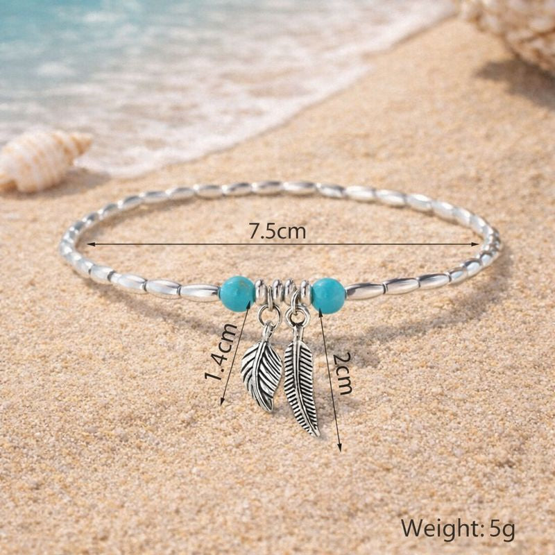 A handcrafted turquoise and gold beaded anklet with a comfortable 7.5cm radius, designed to bring a fresh, earthy vibe to your favorite sandals or holiday outfits.